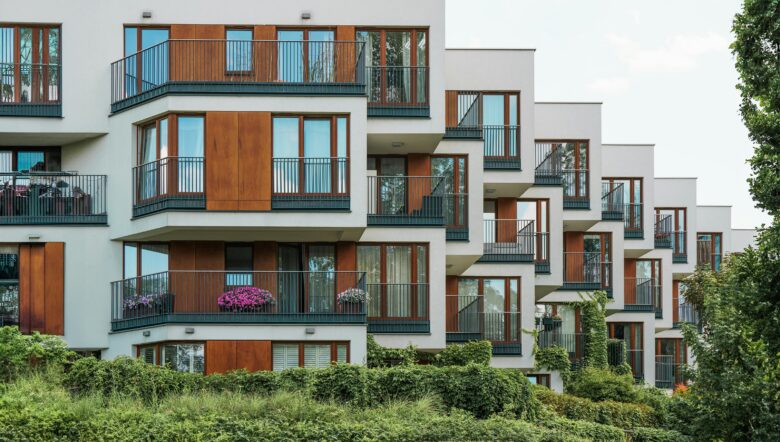 Modern serviced apartments exterior like Ebenezer Hotel Apartments in Kigali, featuring balconies and secure residential design near Kigali International Airport.