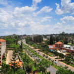 Aerial panorama of upscale Kigali neighborhoods Kacyiru Kimihurura Kiyovu with tree-lined avenues, ideal for Ebenezer Hotel Apartments best stays guide.