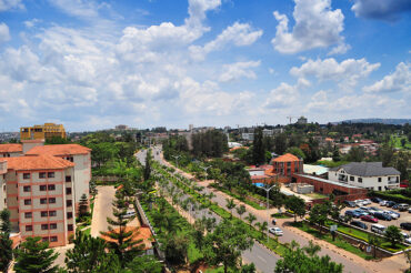 Aerial panorama of upscale Kigali neighborhoods Kacyiru Kimihurura Kiyovu with tree-lined avenues, ideal for Ebenezer Hotel Apartments best stays guide.